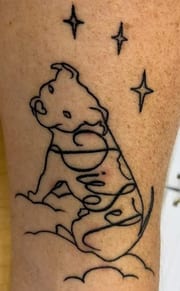 Pit bull on clouds tattoo with the name Diesel hidden in the outline